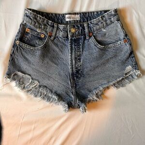 Zara denim cutoff shorts in a size 6 distressed high rise frayed 29 inch waist
